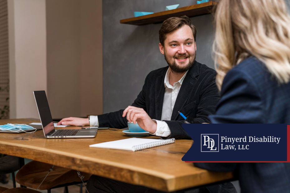Attorney smiling while meeting with a client