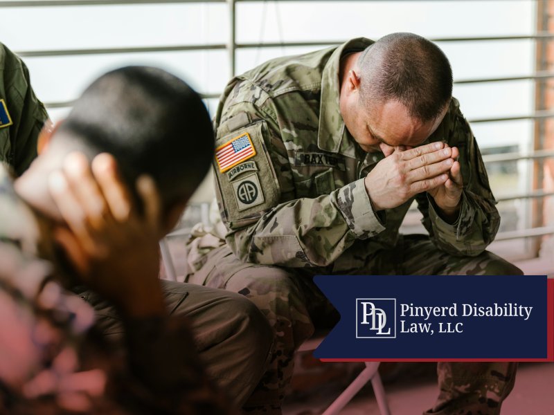 Service member with his head in his hands