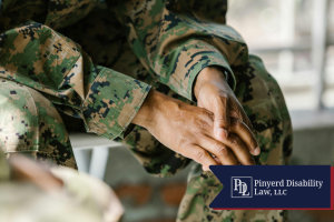 Close-up of service members' clasped hands in camouflage uniforms