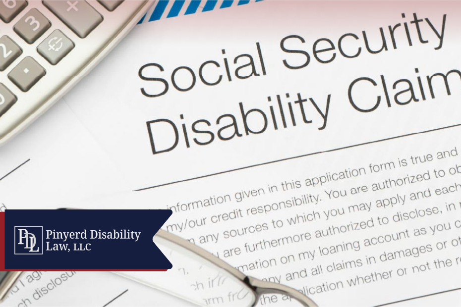 Social Security disability claim form with a calculator and glasses