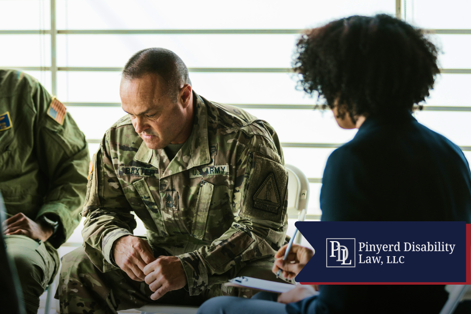 Soldier looking down while a counselor takes notes