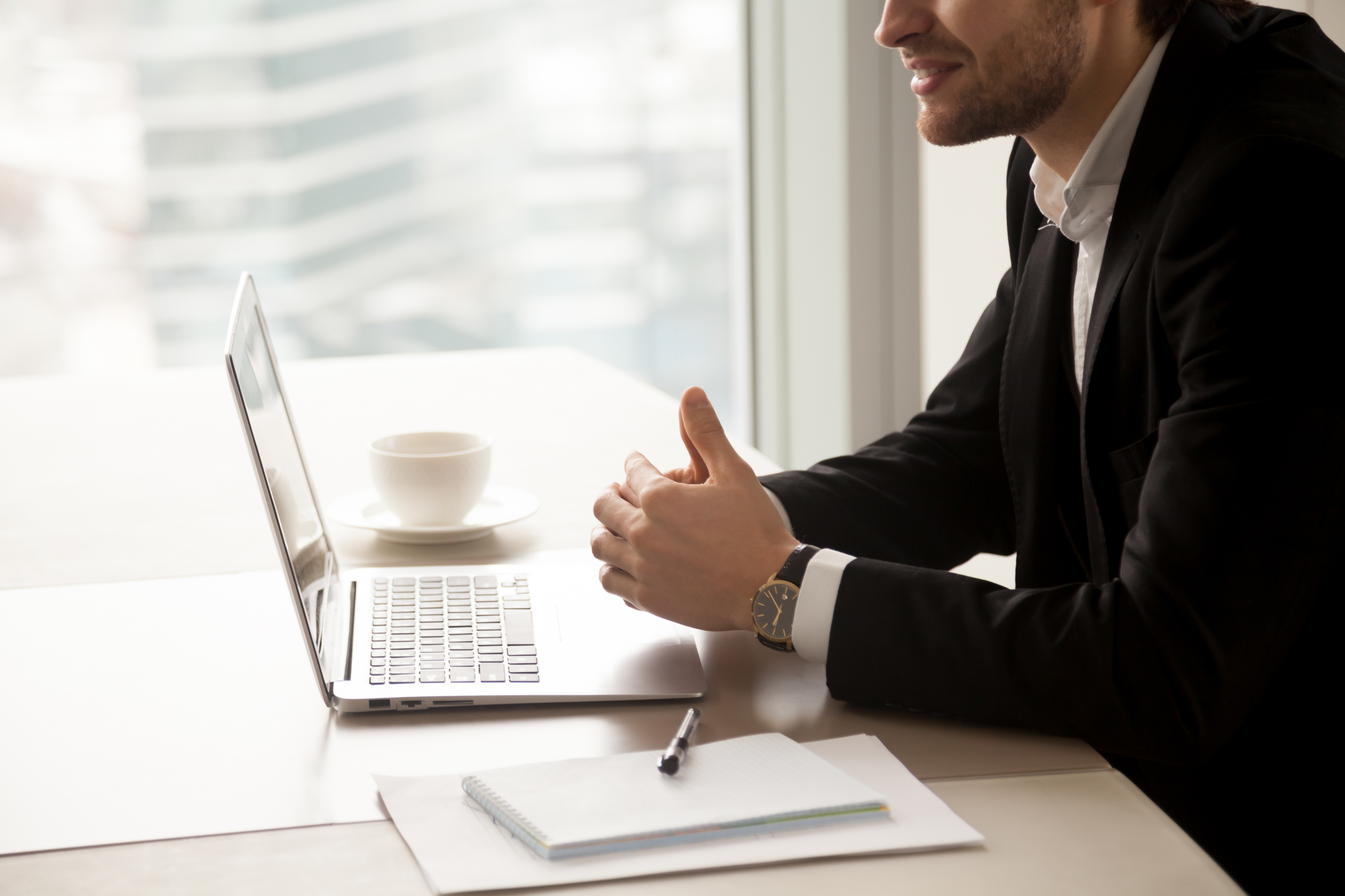 Attorney giving a thumbs up during a video consultation