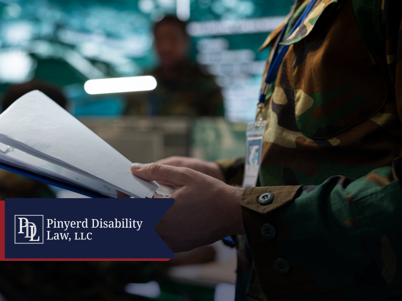 Service member holding a folder of papers